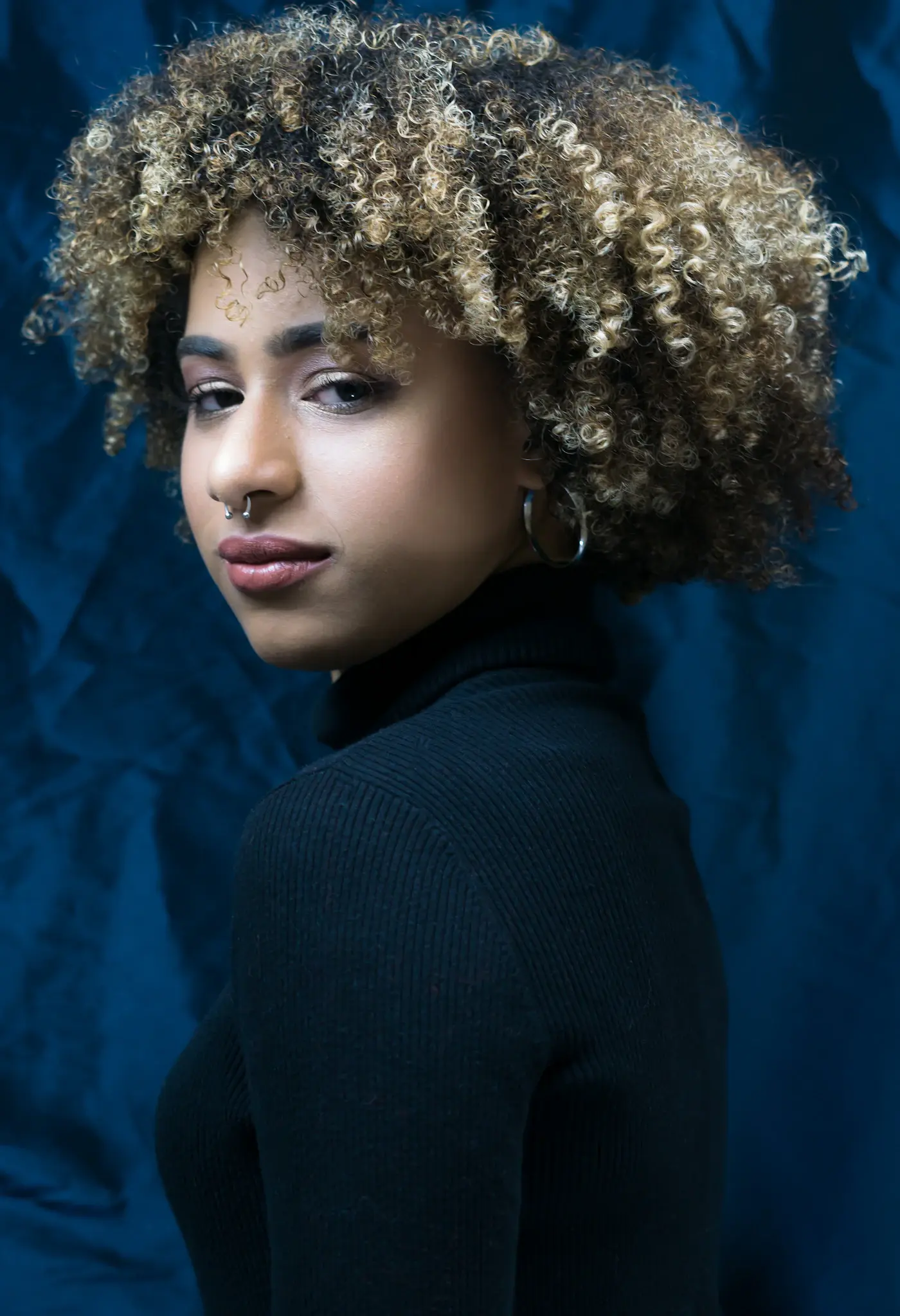 Portrait of a person with textured curls
